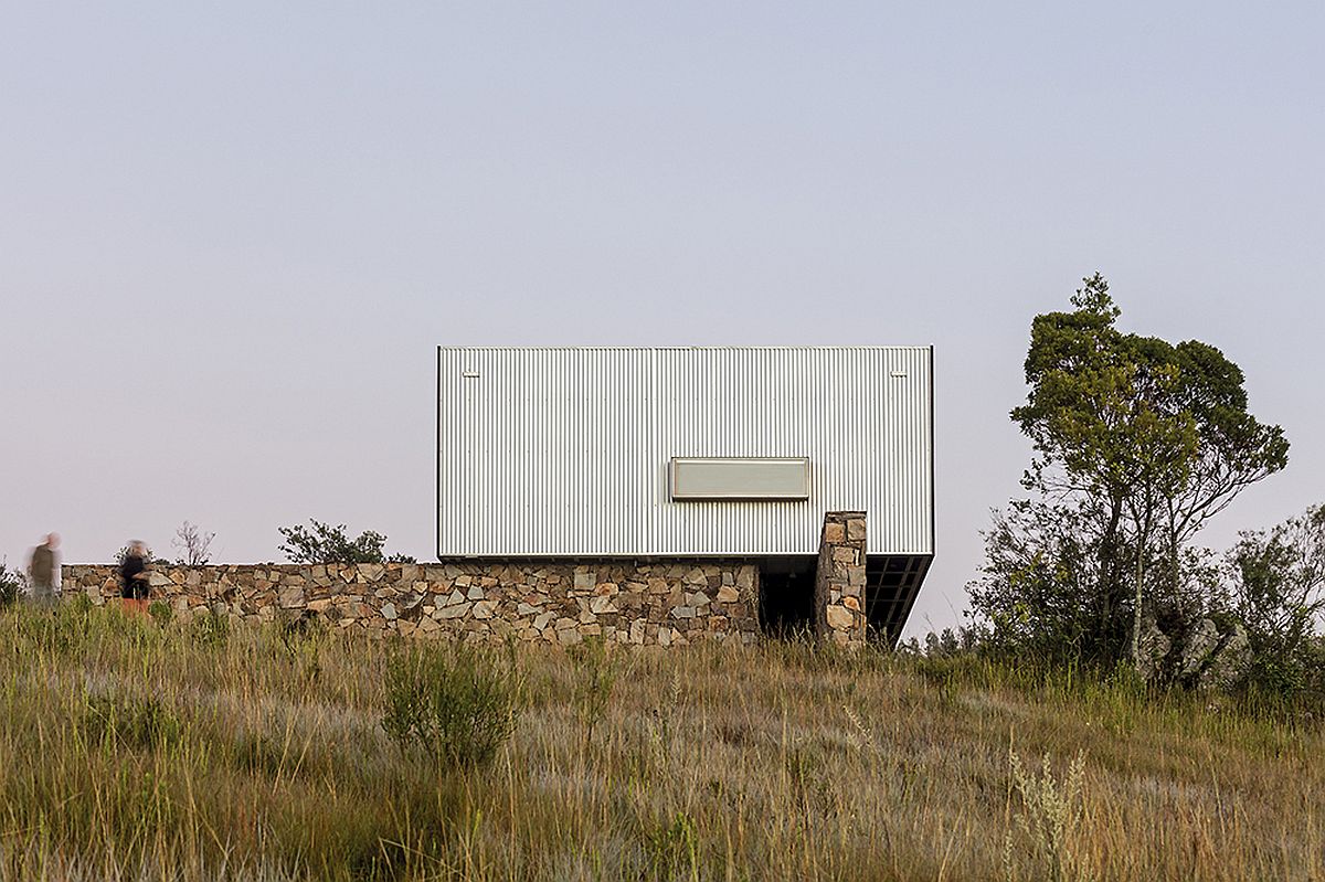 Stone walls support the prefab structure