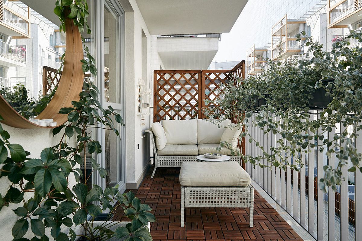 Terrace of the small apartment with wicker decor and greenery