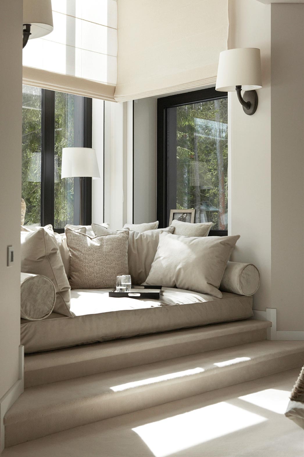 The cushy and comfortable reading nook decorated in subtle neutral hues