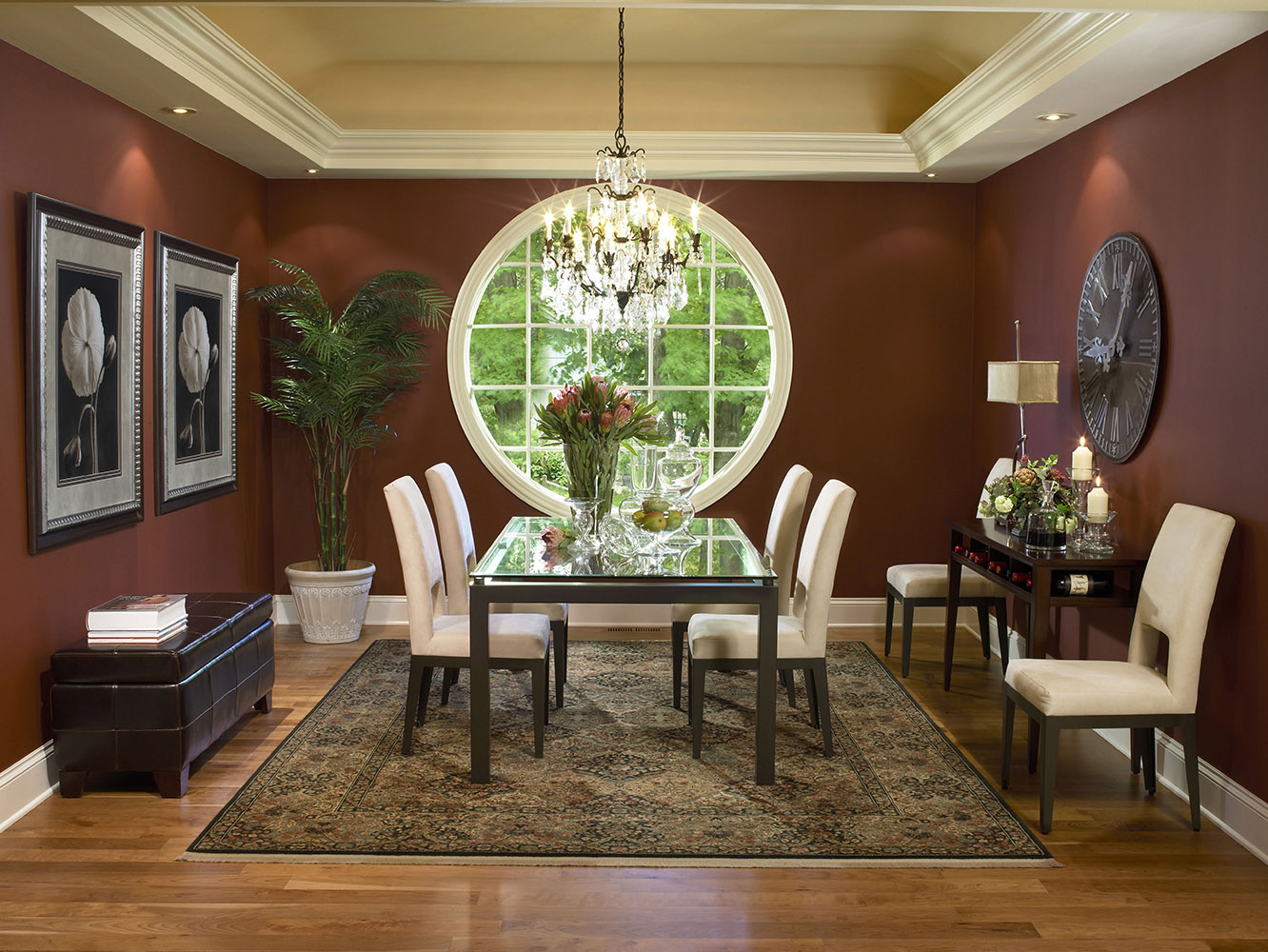 Traditional dining room with a large round window