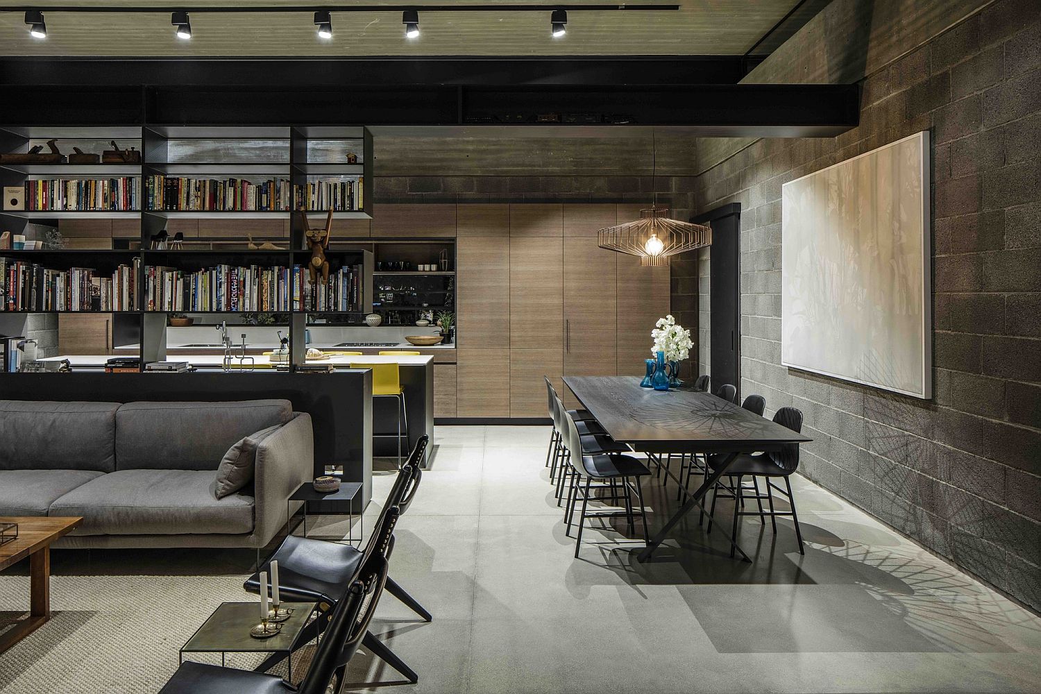 Two-sided library separates the lounge from the kitchen