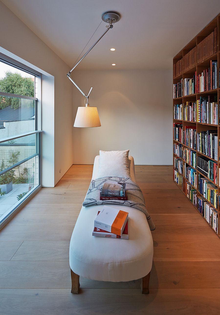 Home library with shelf that also helps delineate space