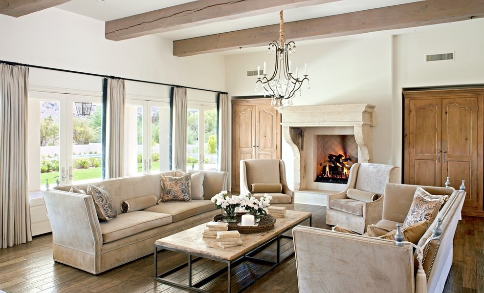 Visible beams and defining beige interior in a cozy living room