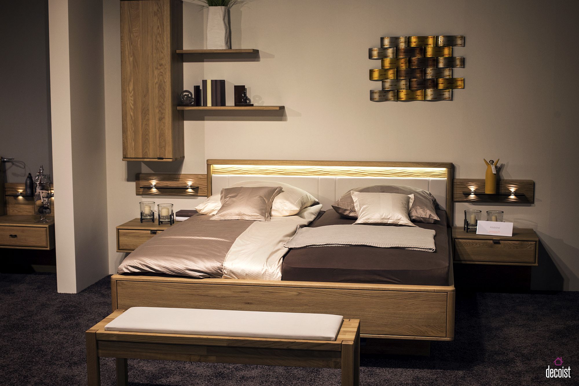 Wall-mounted cabinets and shelves next to the bed