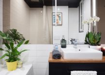 White-sink-wooden-countertop-and-dark-bathroom-vanity-for-the-modern-bathroom-217x155