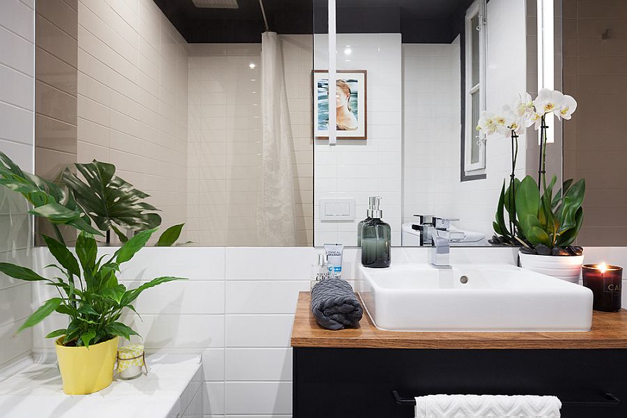 White sink, wooden countertop and dark bathroom vanity for the modern bathroom