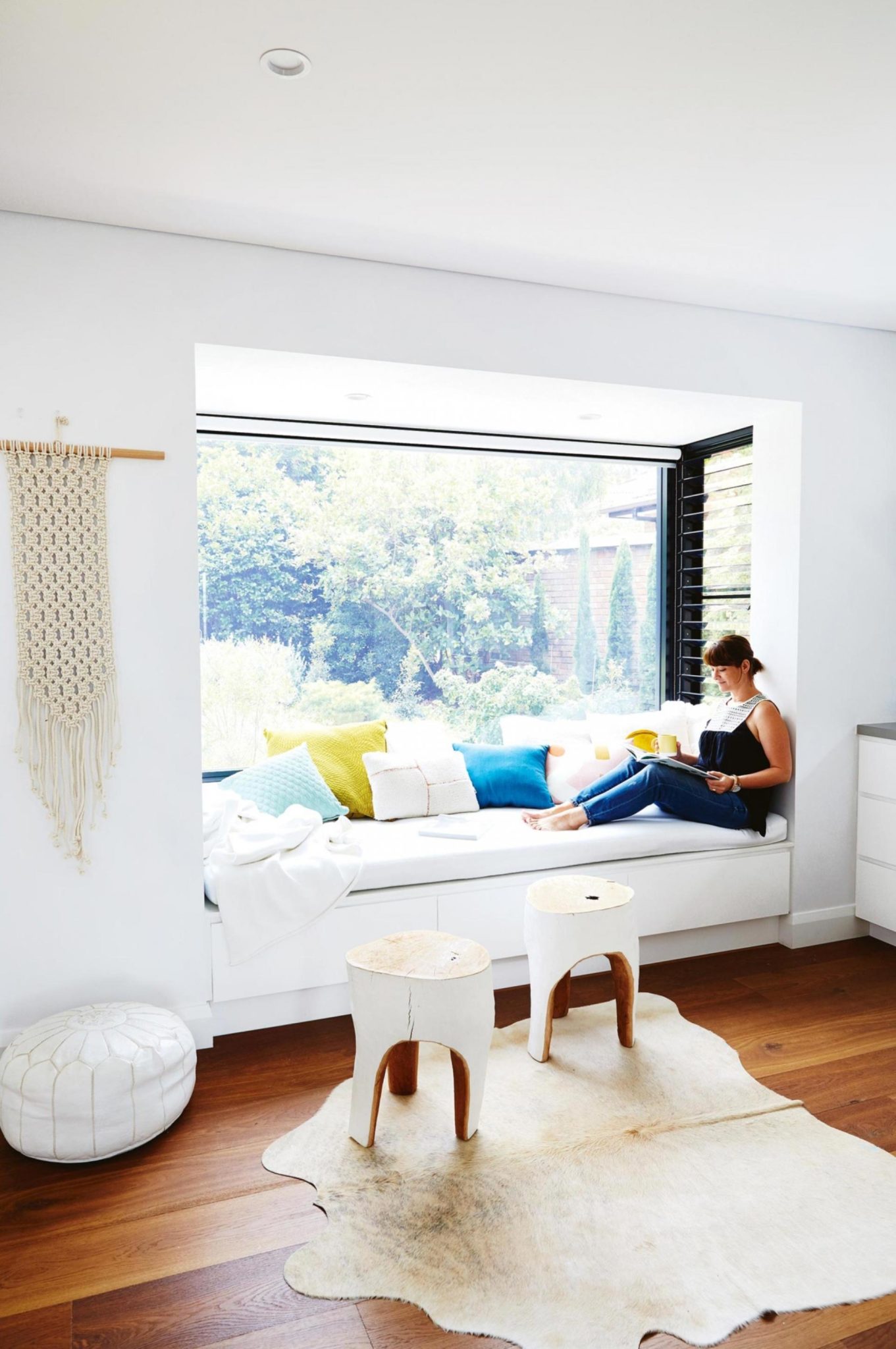 White-sunlit-window-seat-reading-nook-