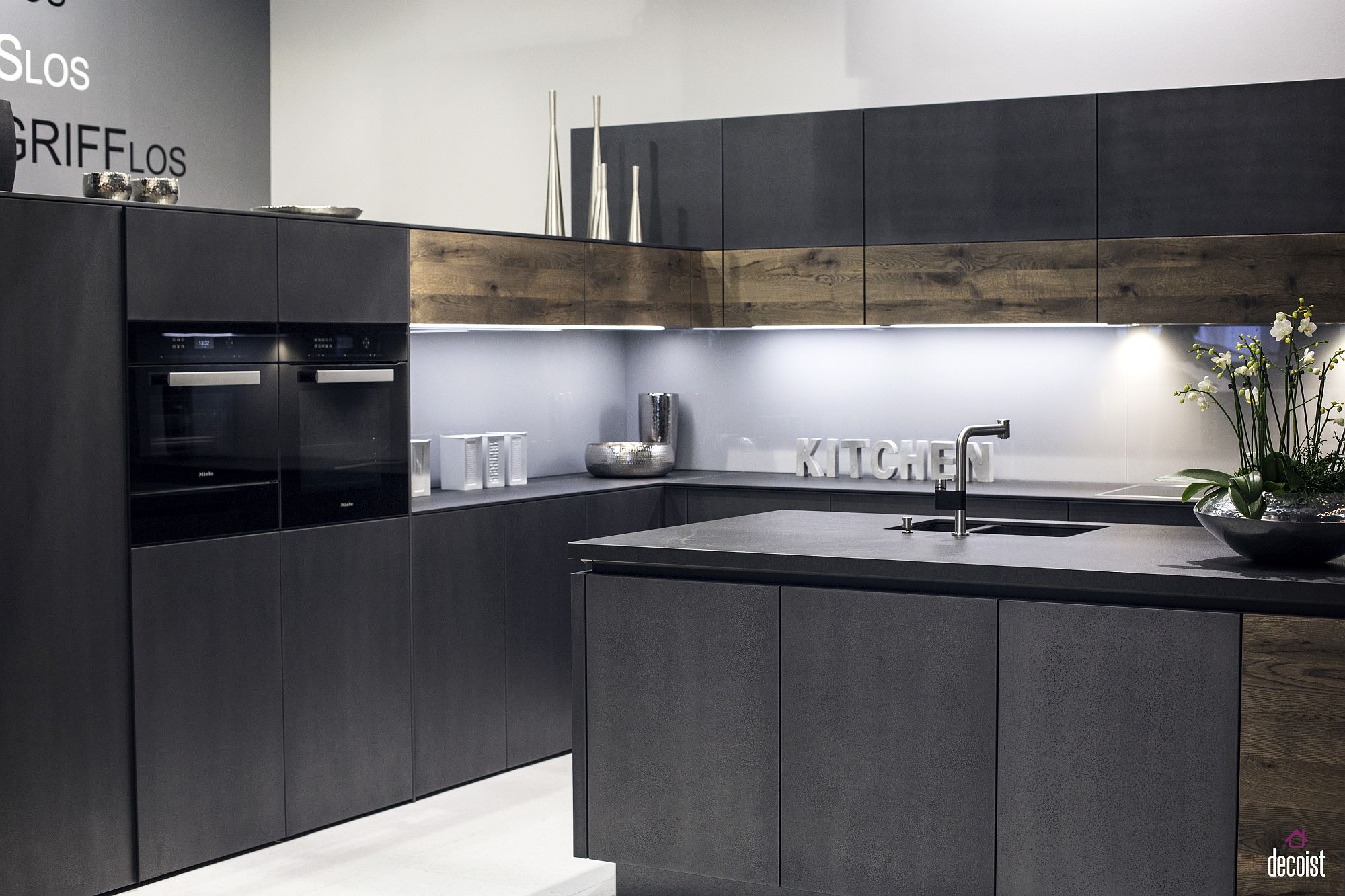 Wooden cabinets add warmth to kitchen in white and gray