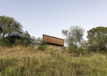 Wooden-facade-of-the-prefab-can-switch-between-unabated-views-and-complete-privacy-217x155