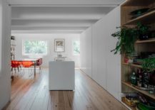 Wooden-floor-brings-warmth-to-the-polished-interior-in-white-217x155
