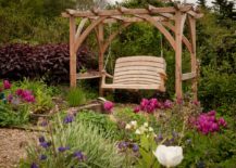 Wooden-garden-swing-among-flowers--217x155