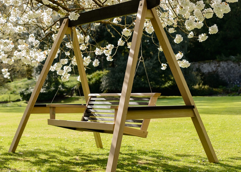 Wooden garden swing in a magical setting