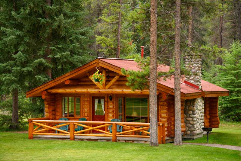 A beautiful log cabin with a glistening exterior