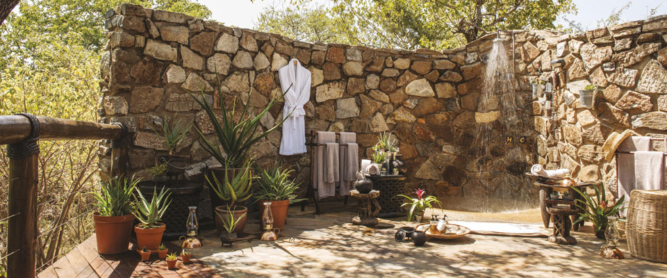 A beautiful shower set up with raw blocks of stone