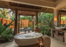 A-full-size-outdoor-bathroom-with-a-big-tub-and-an-open-shower-217x155