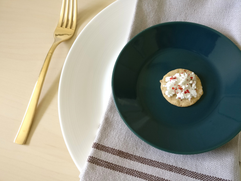 A linen napkin offsets a teal plate