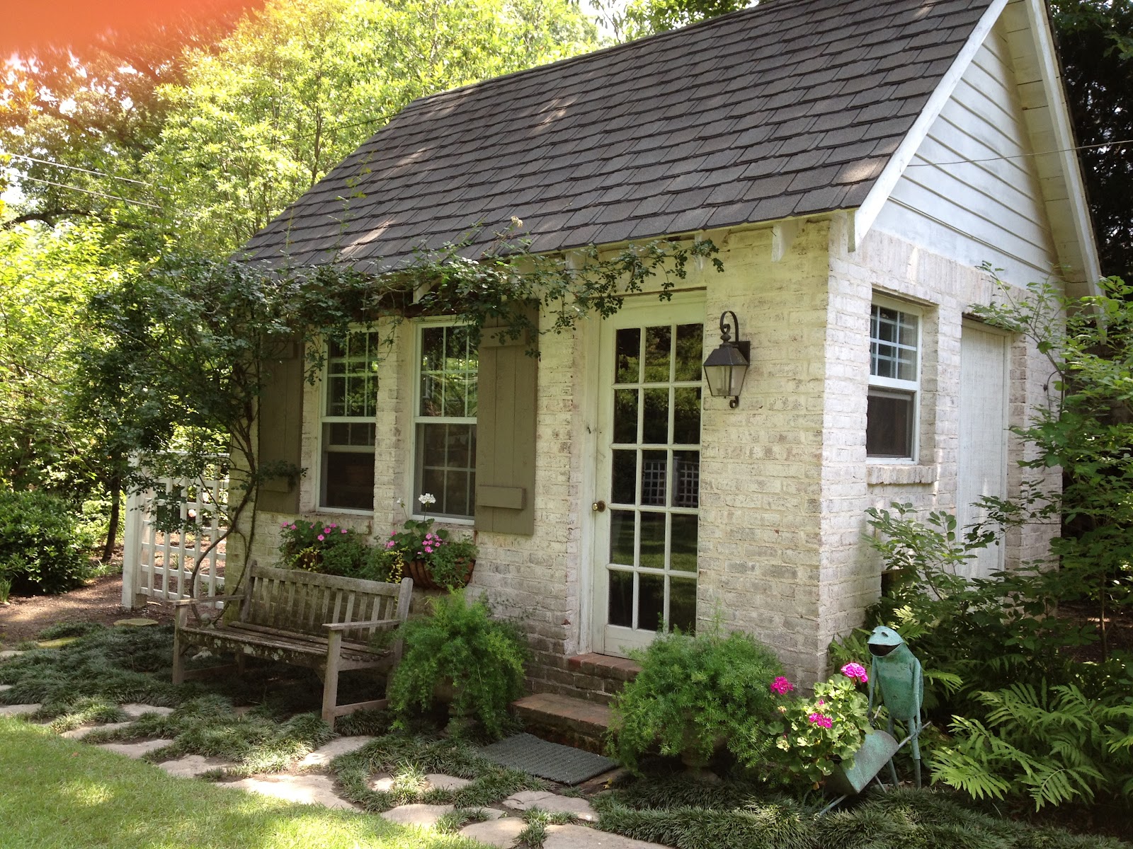 A little stone shed with natural greens as decor