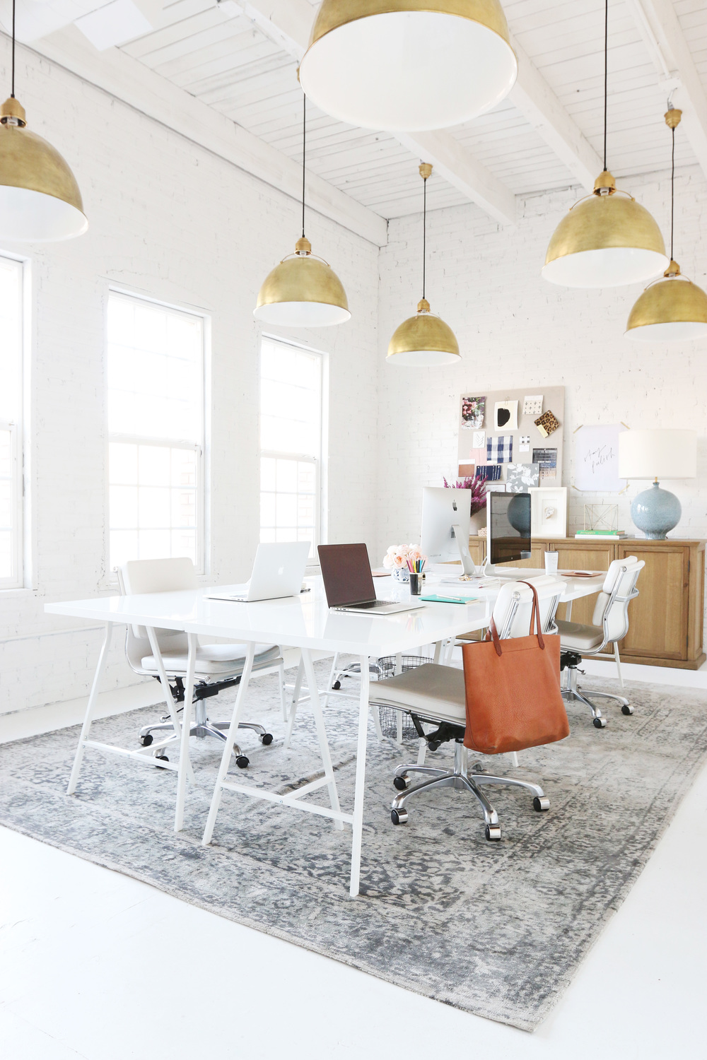 All-white office with golden lamps