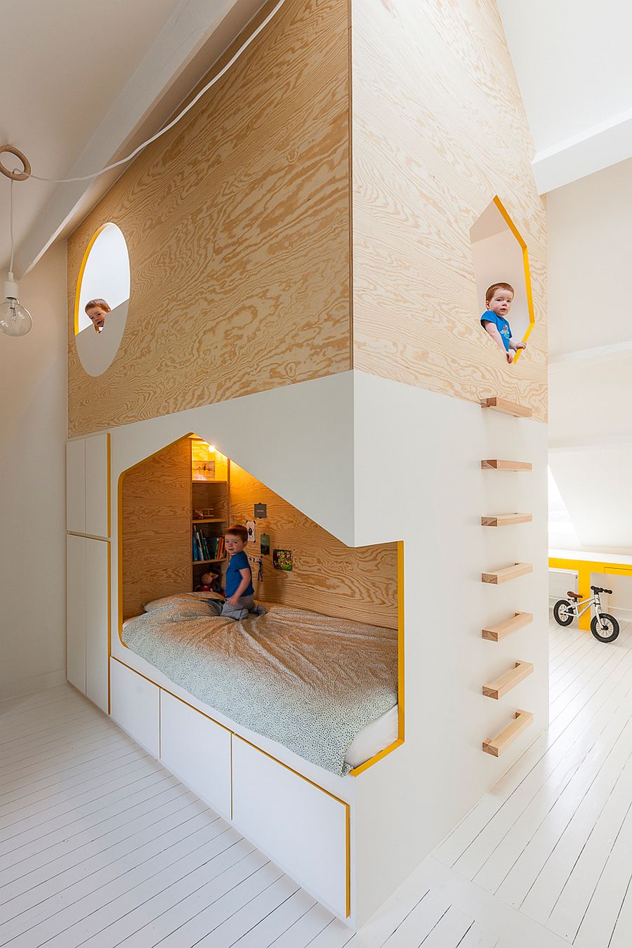 Bespoke kids' bed design with twin beds and a loft playspace