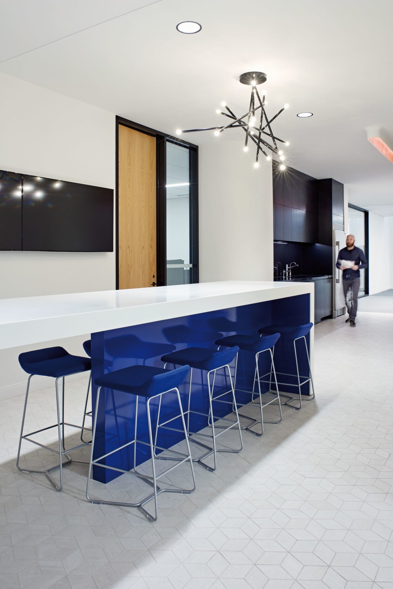 Blue, white, wood and orange shape the gorgeous office