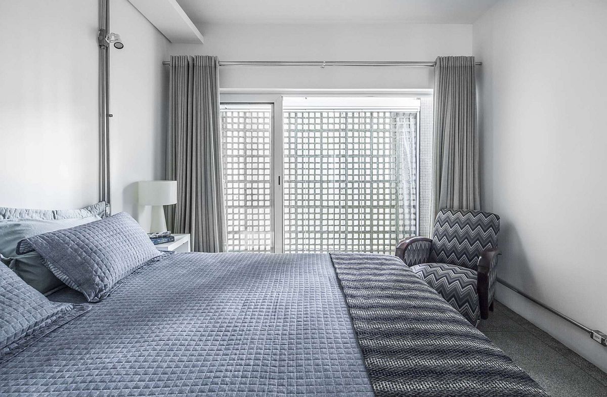 Breeze blocks bring light into the industrial bedroom