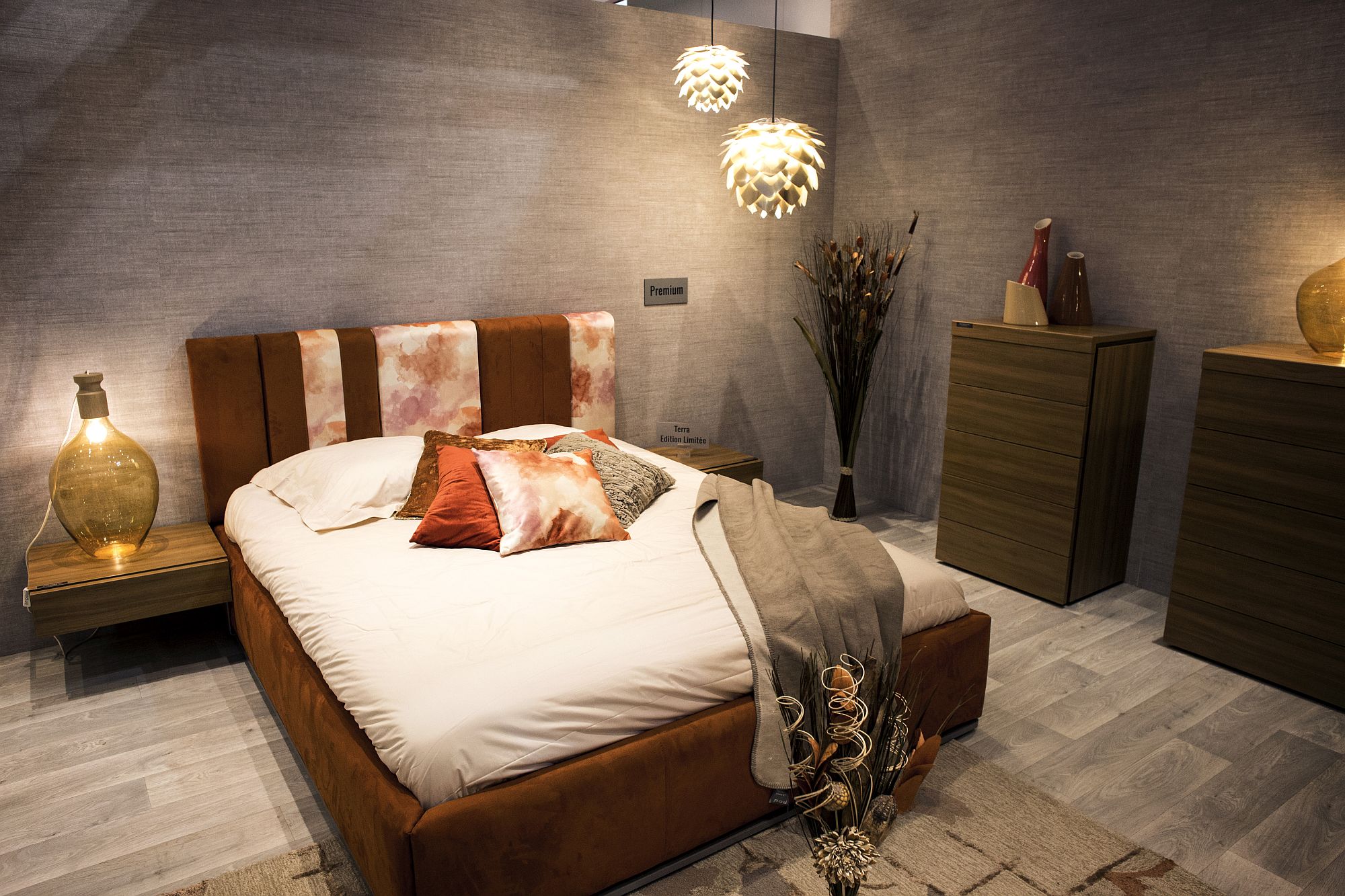 Burnt orange brings color and glamor to the modern bedroom with innovative lighting