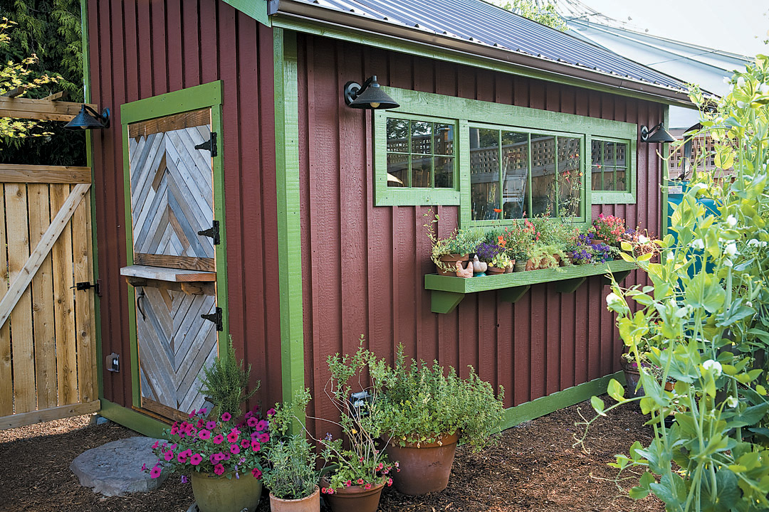 Dark red wooden shed with a vibrant green trim