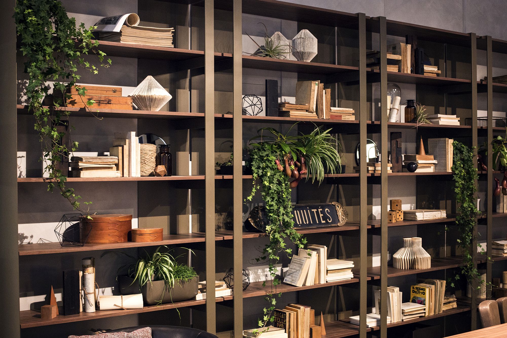 Floor-to-ceiling bookshelf decorated in style