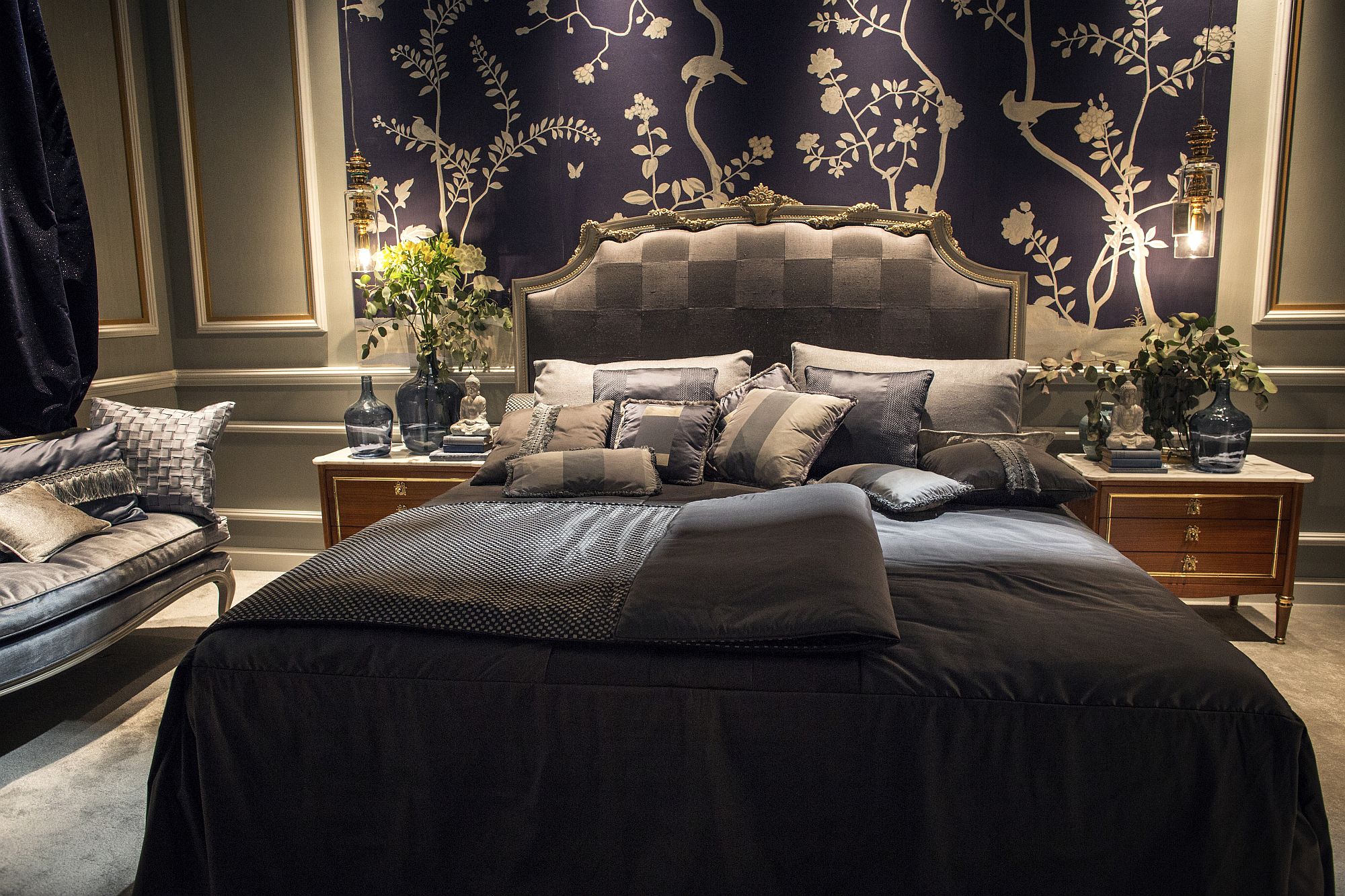 Flowers on the tabletop complement the unique backdrop in the bedroom