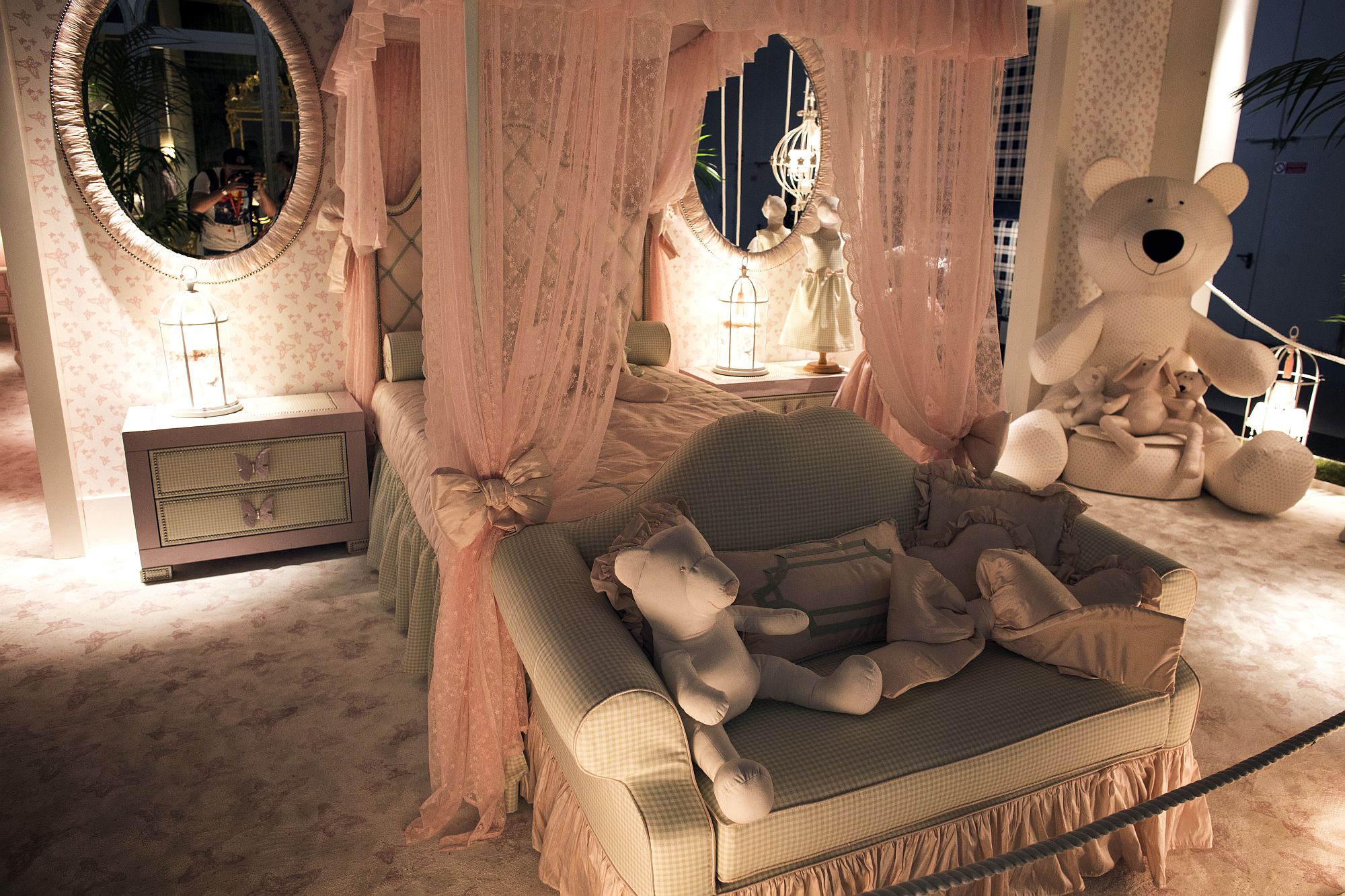 Four poster bed with canopy becomes the focal point of the lavish princess themed kids room