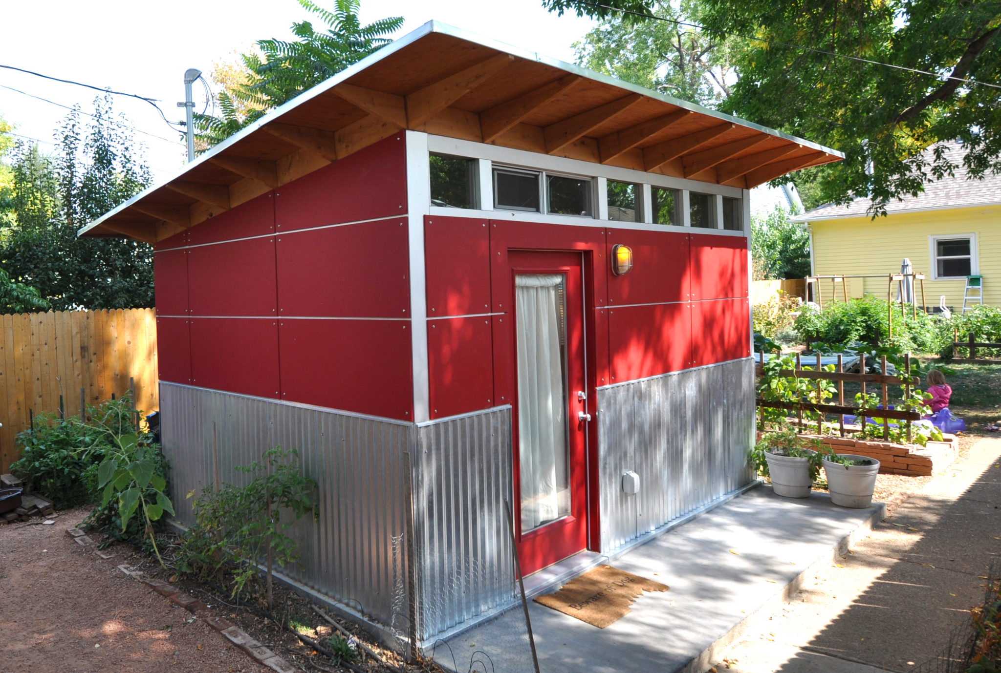 Garden shed in a bold and bright shade of red