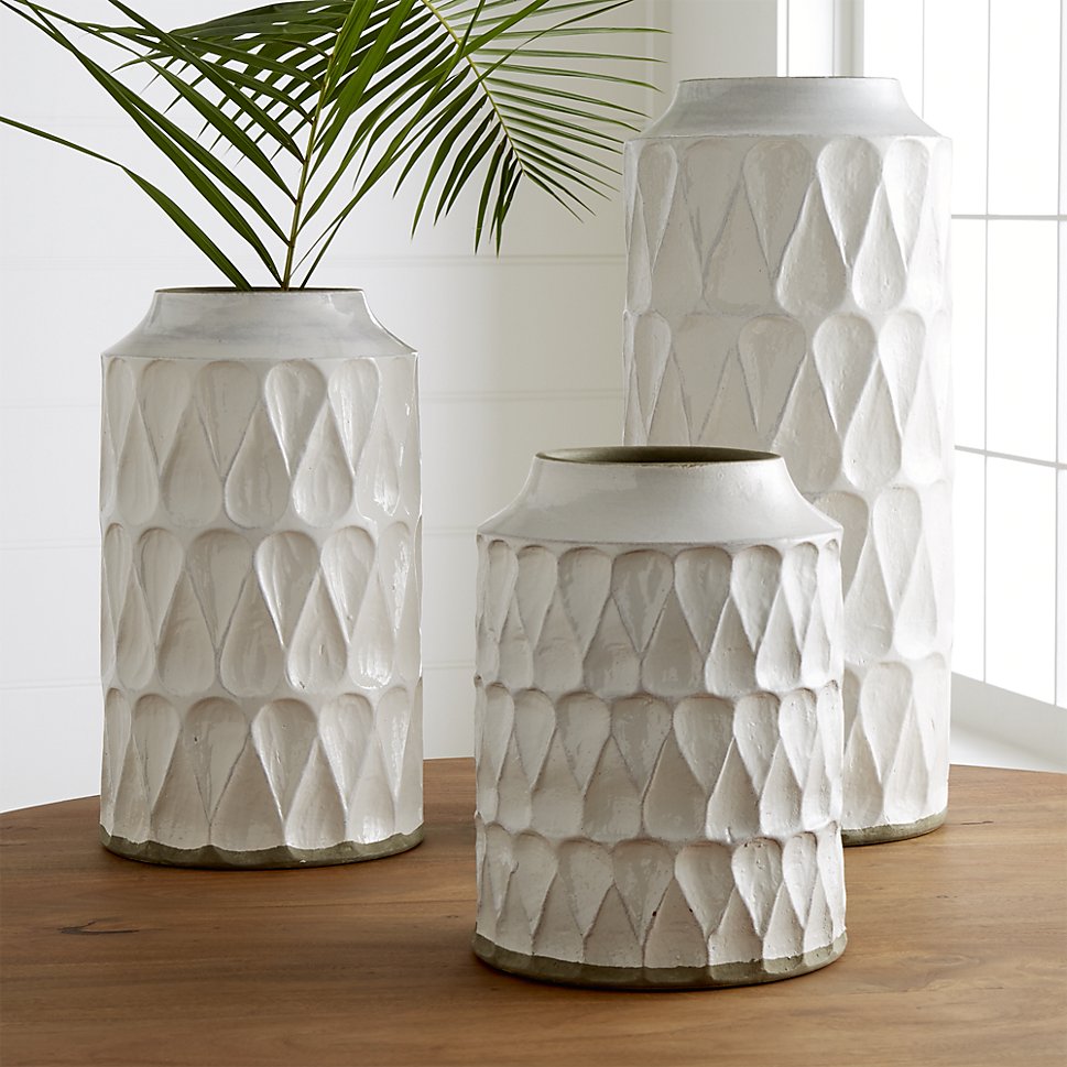 Glazed stoneware vases with tropical leaves