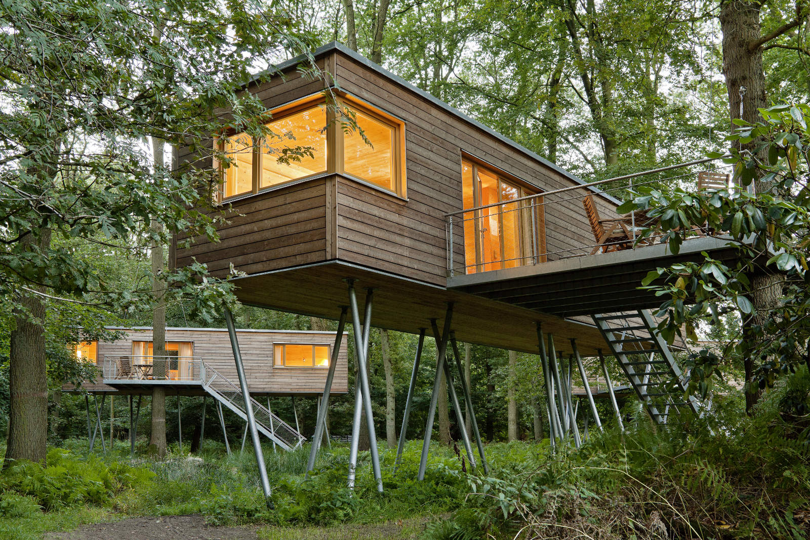 Gracefully-built-wooden-treehouses-in-a-forest