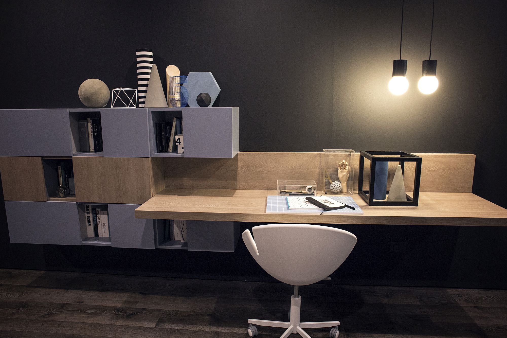 Home office shelf decorated with geo style vases