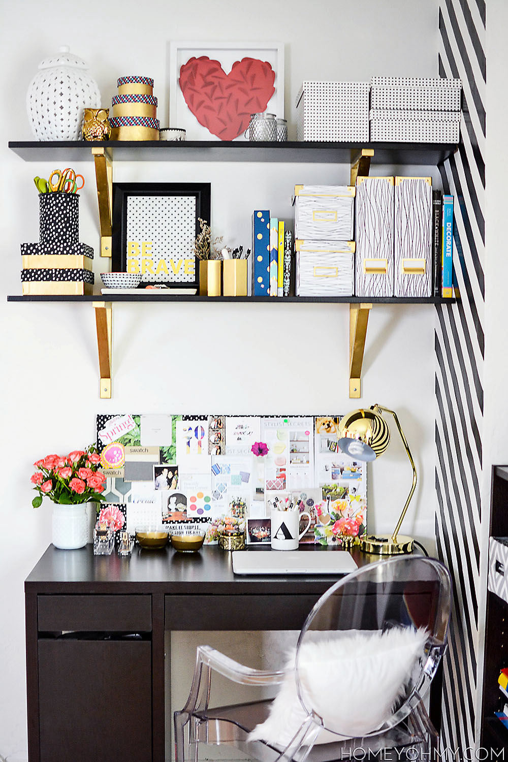 Home office with glossy gold decor elements