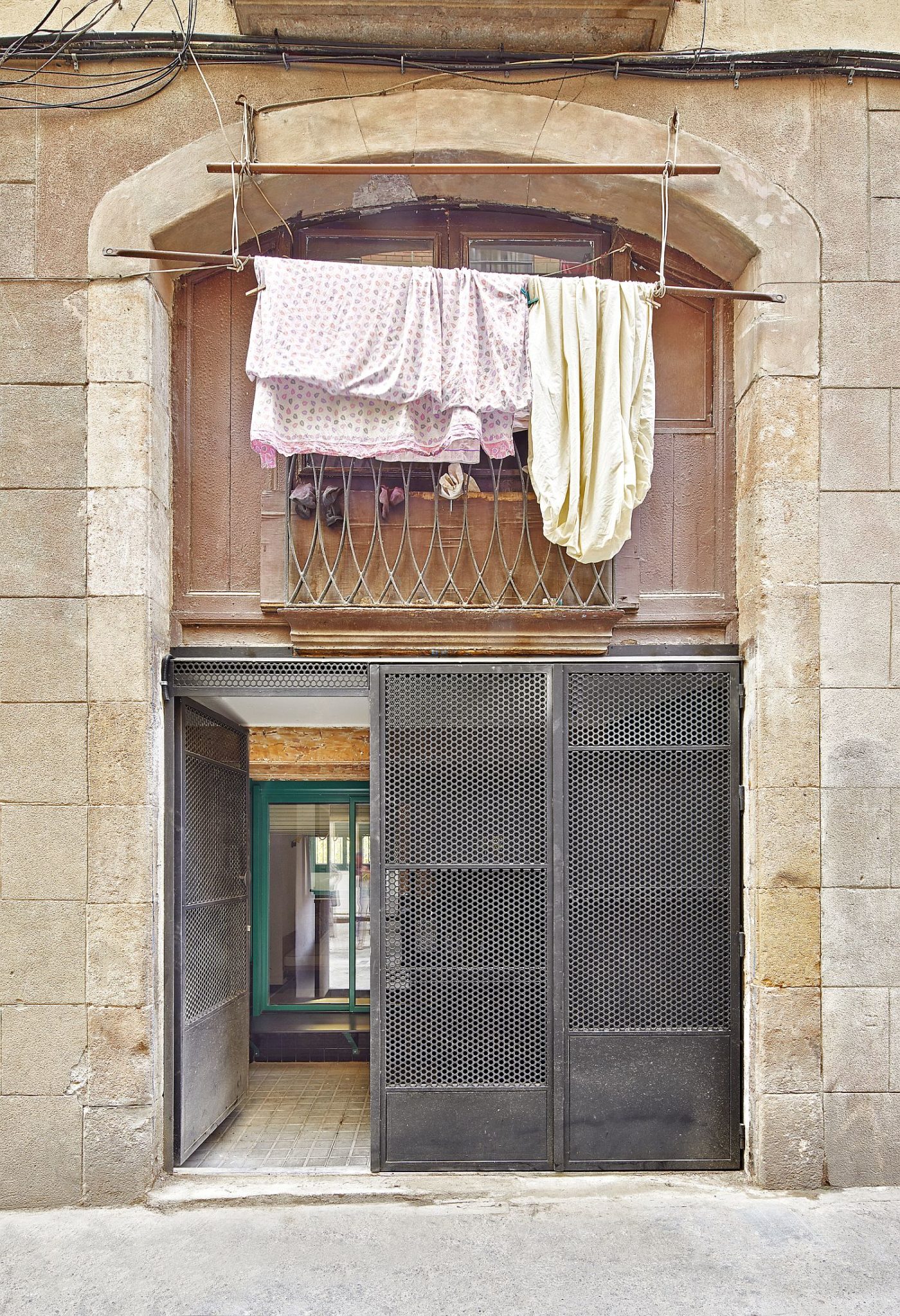 Iron mesh doors keep out the busy street noise