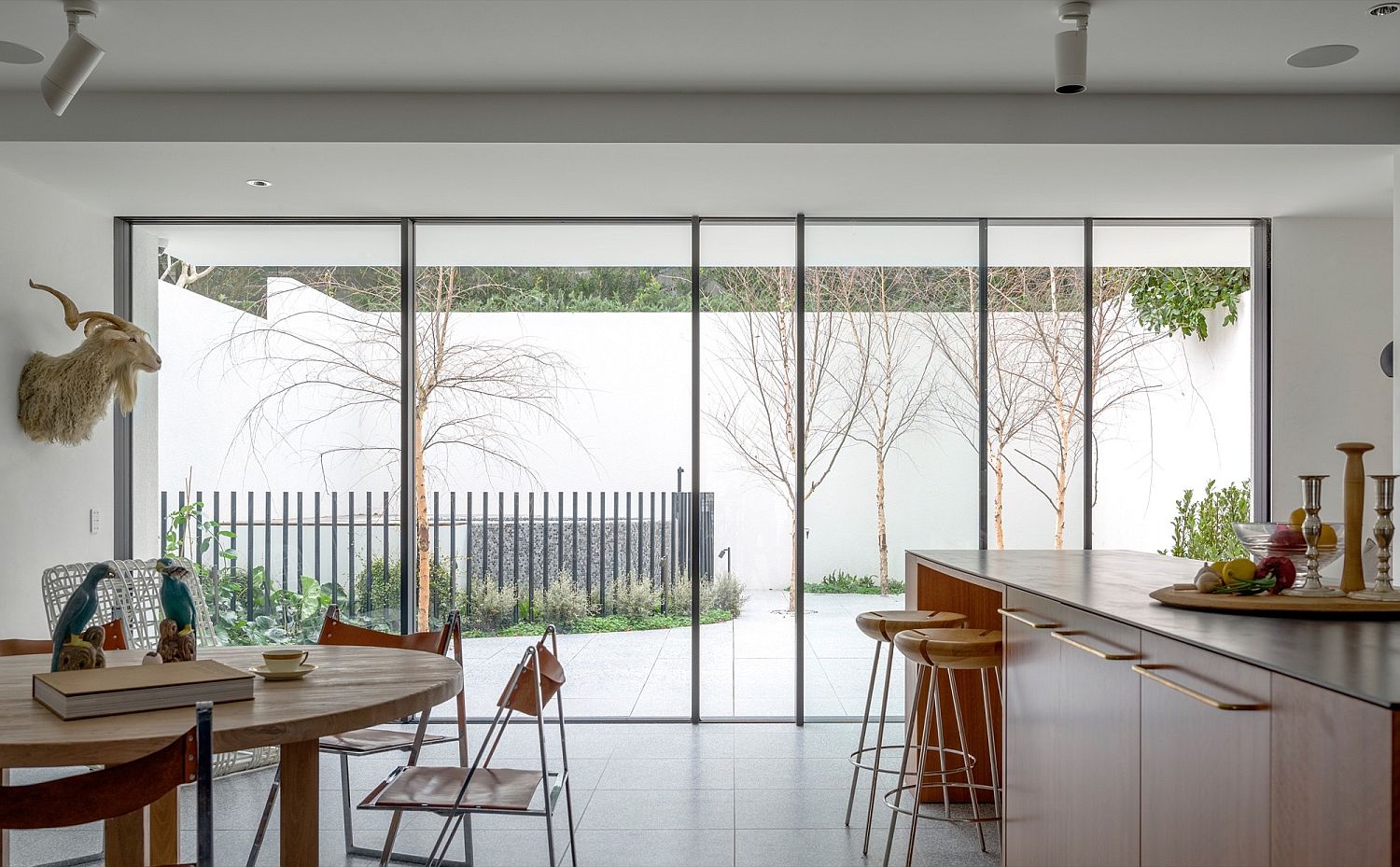 Kitchen and dining area connected with the view outside