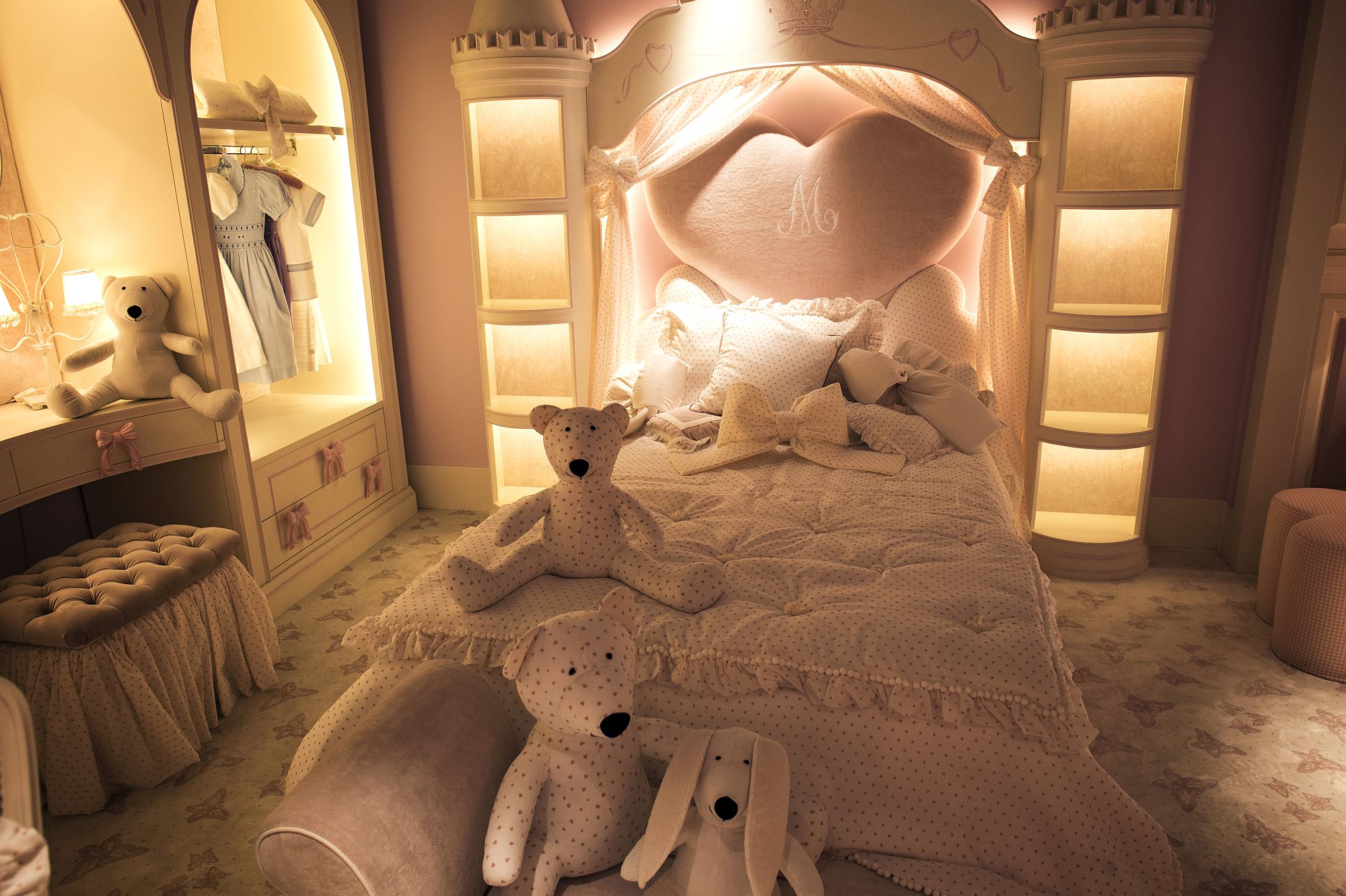 Lighting plays a major role in shaping the luxurious ambiance of this girls' bedroom