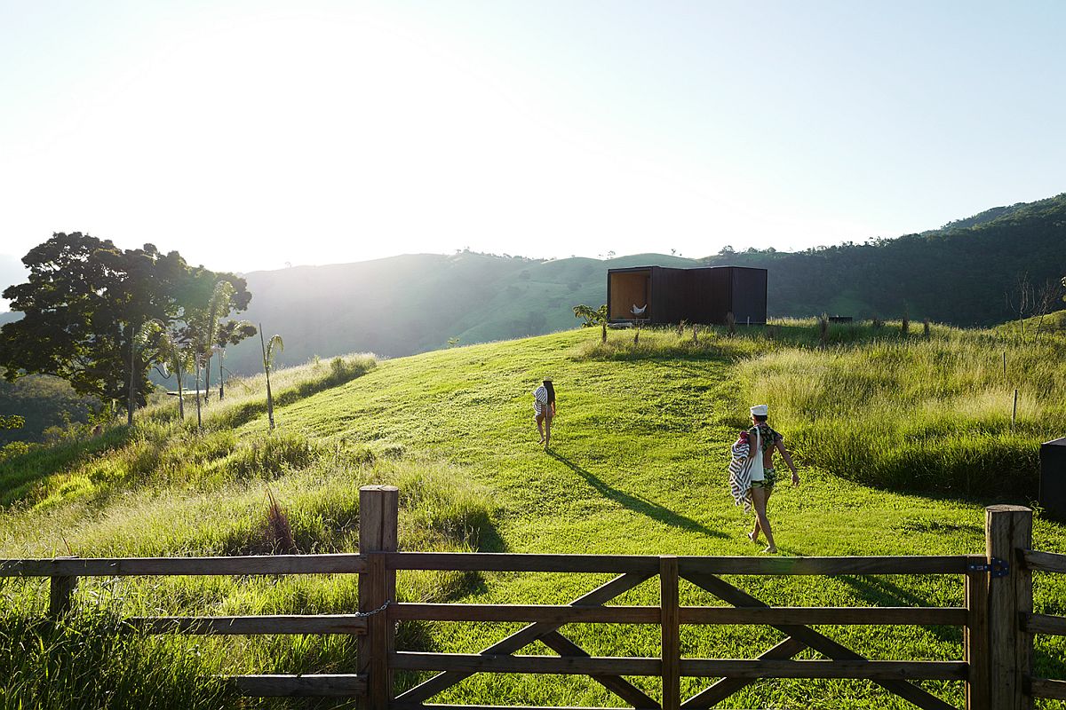 Lush green landscape around the prefab home