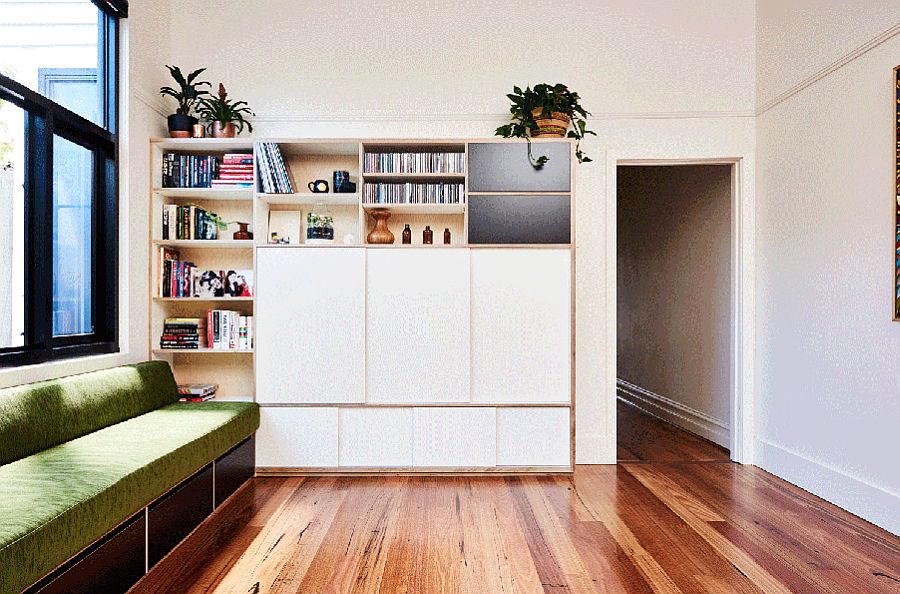 Multitasking family room wall with space for TV and books