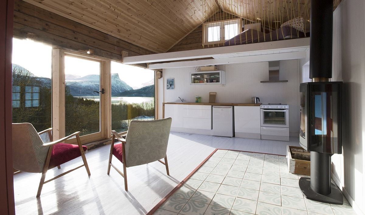 Open-living-area-with-large-window-offers-a-view-of-the-spectacular-fjords