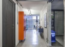 Orange-cabinets-and-accents-enliven-the-modern-industrial-interior-217x155