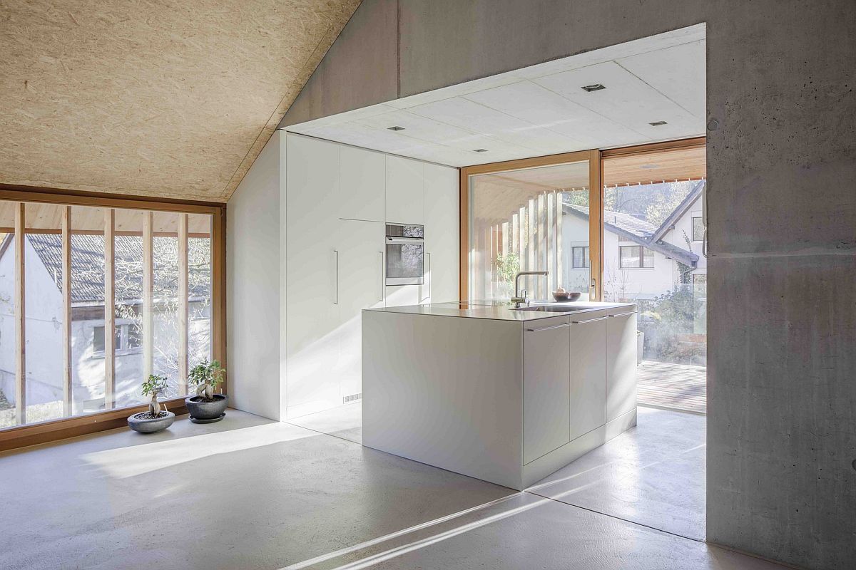 Polished living room and kitchen with ample natural light