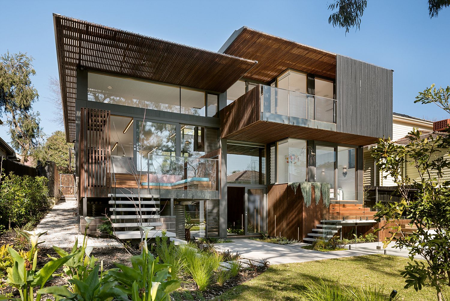 Rear facade of the home opens up towards the garden