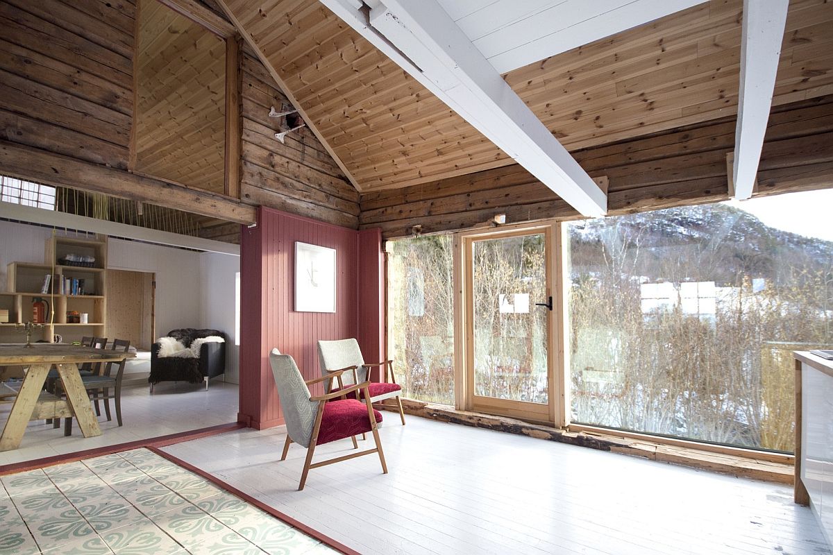 Red accents and natural light brighten the interior