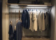 Sleek-shelves-and-lighting-combine-to-create-a-cool-corner-wardrobe-217x155