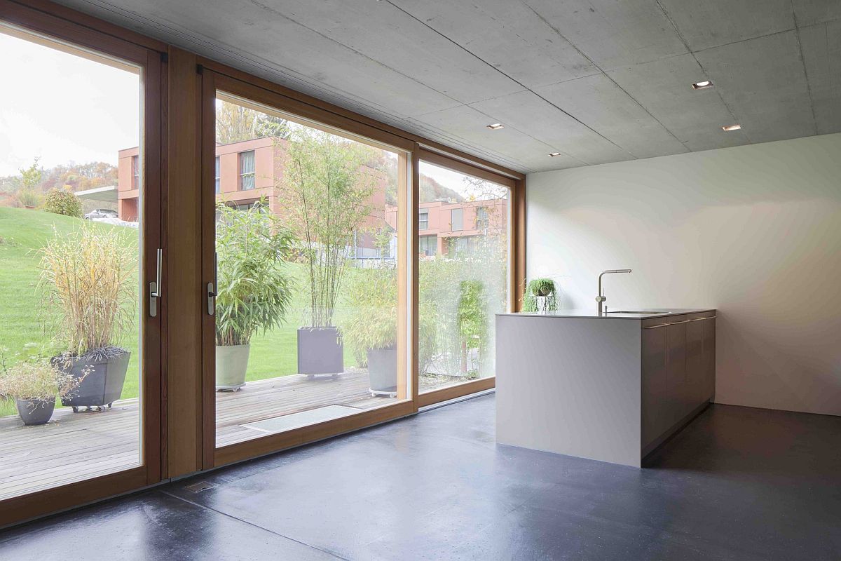 Sliding-glass-doors-with-wooden-frame-bring-in-natural-light