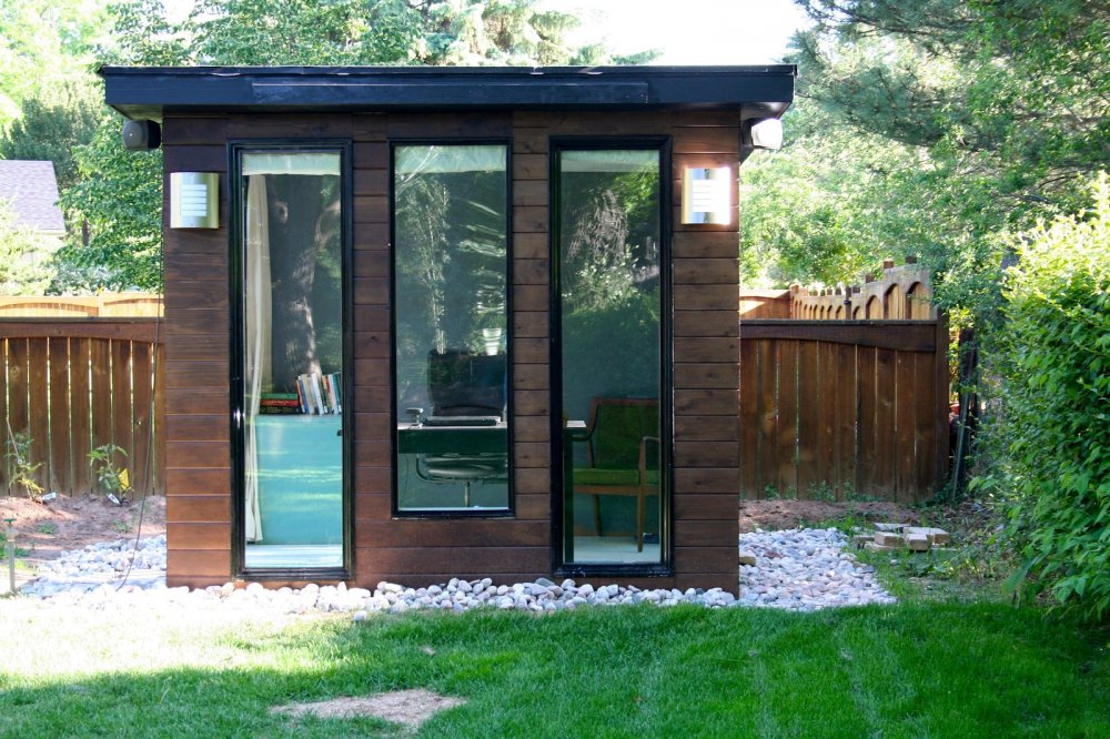 Small backyard shed with tall windows