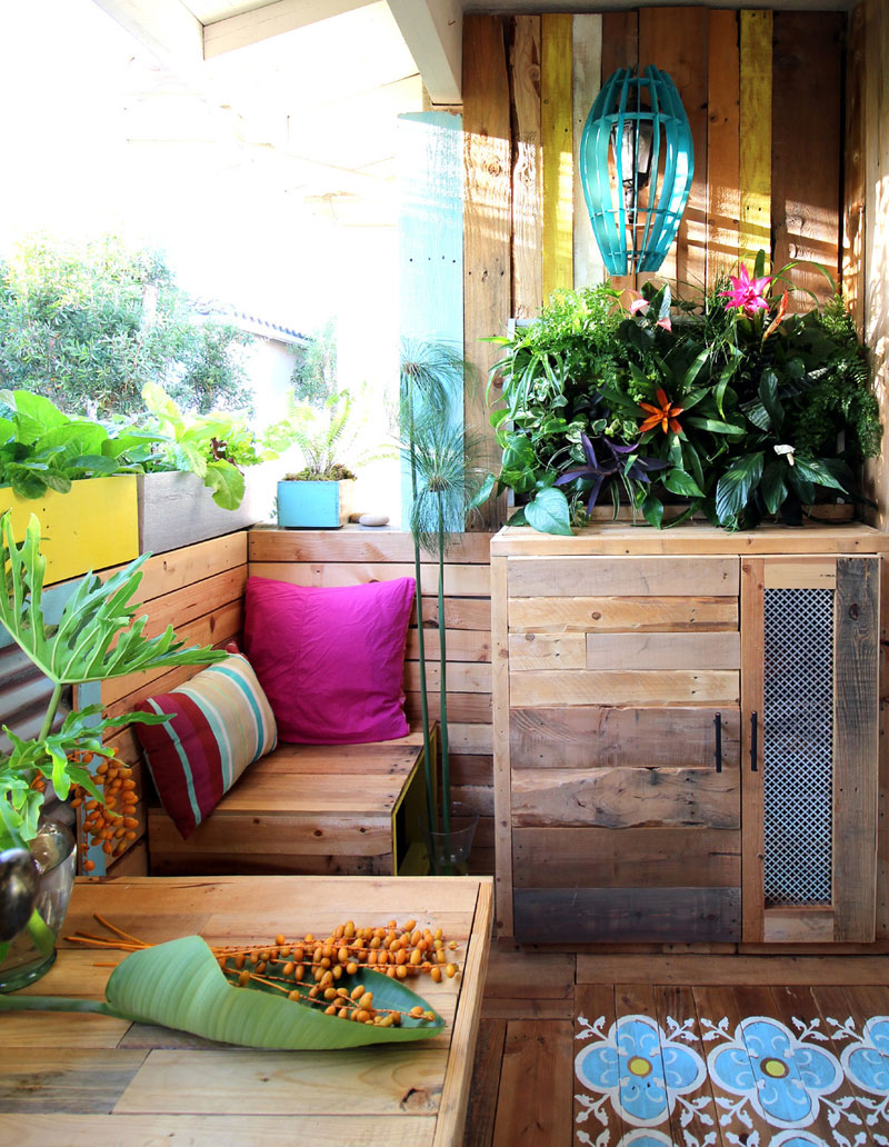 Tiny balcony with wooden decor and smaller colored elements