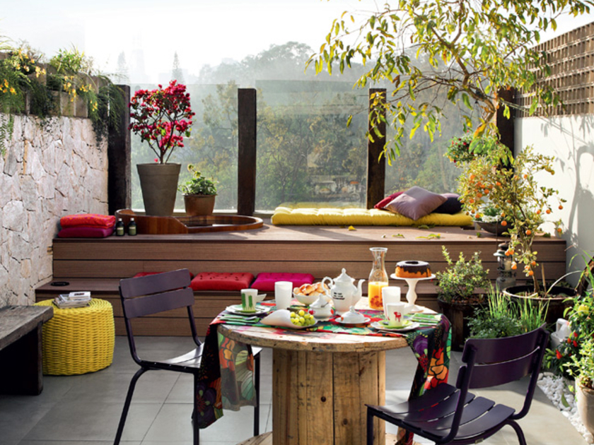 Tiny-balcony-with-yellow-and-red-sitting-cushions